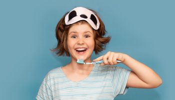 At What Age Should a Child Be Proficient at Brushing and Flossing?