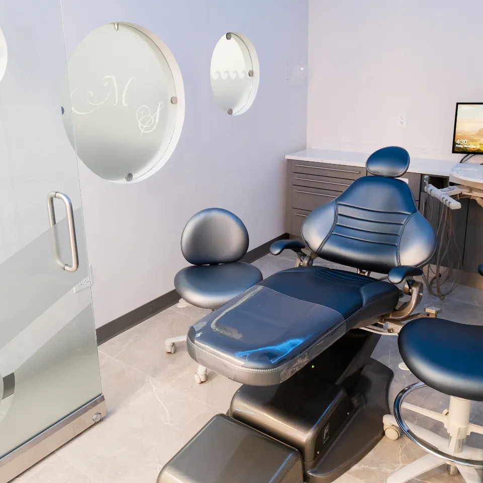 Dental treatment chair in a visitor room at Millennium Smiles