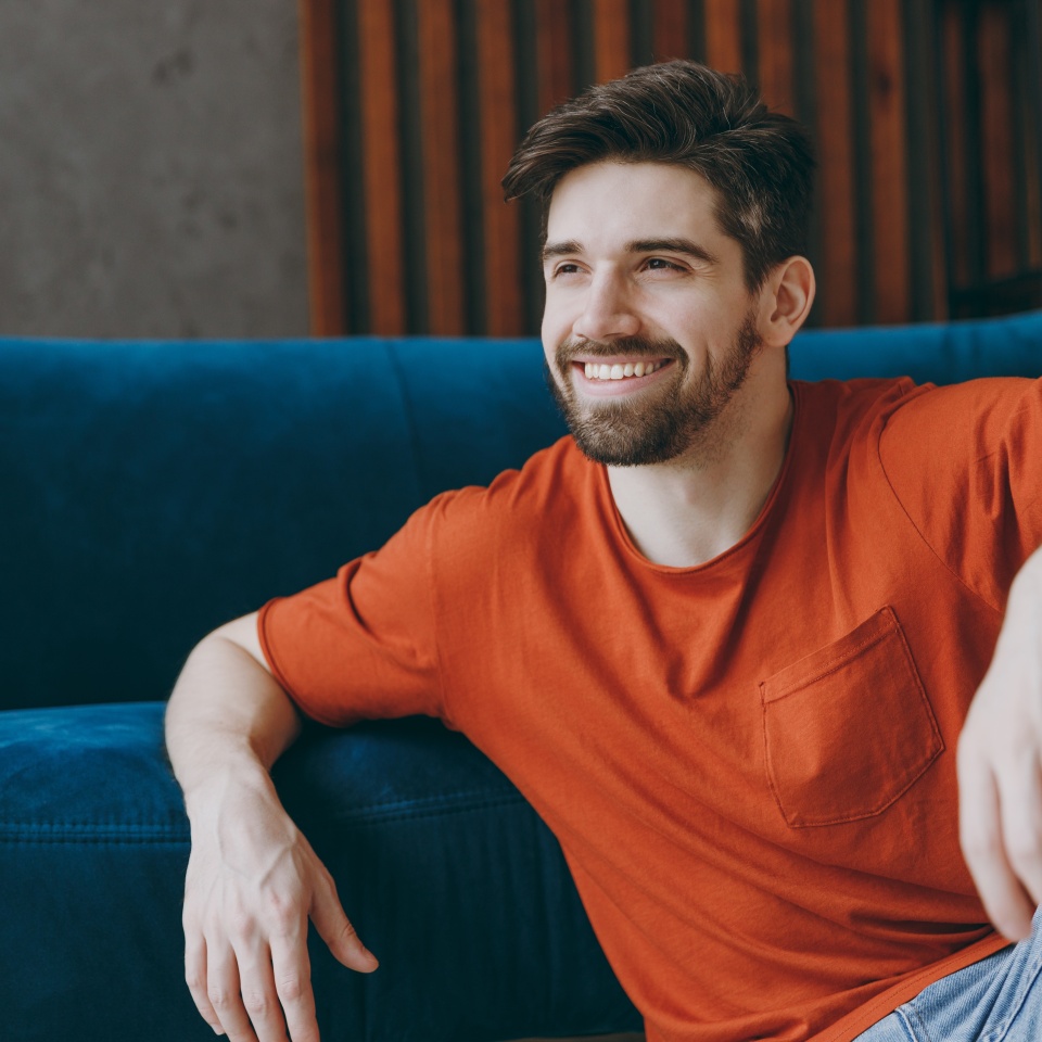 Young man relaxing on a sofa at home