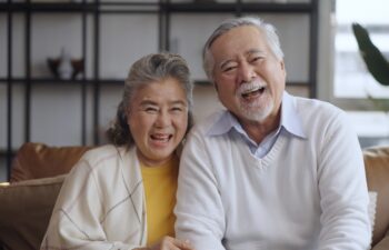 Senior couple smiling together at the camera