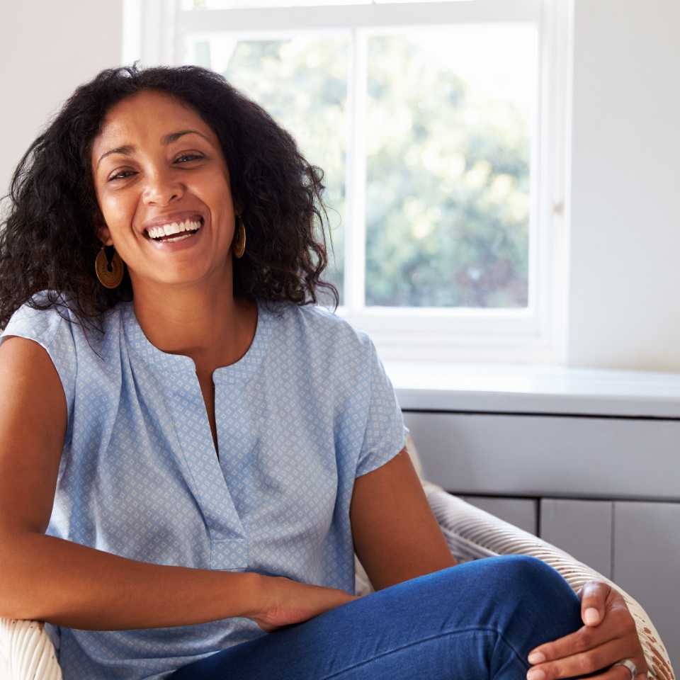 Woman sitting in a chair at home