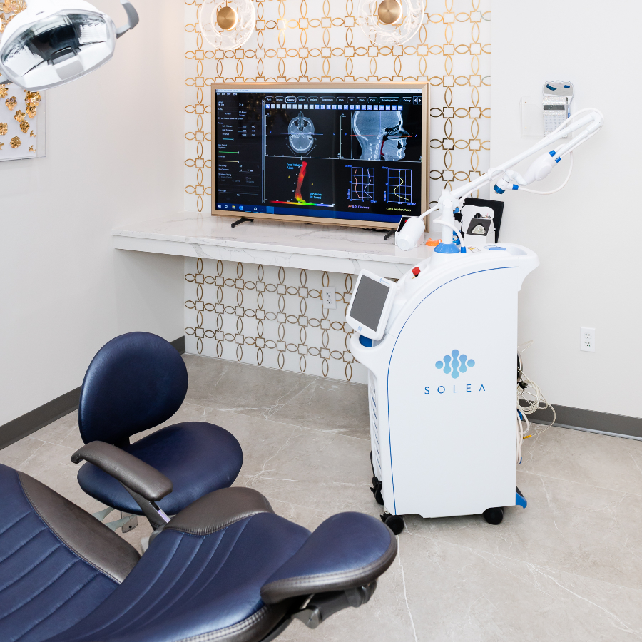 Solea laser dental setup with chair and monitor displaying dental imaging